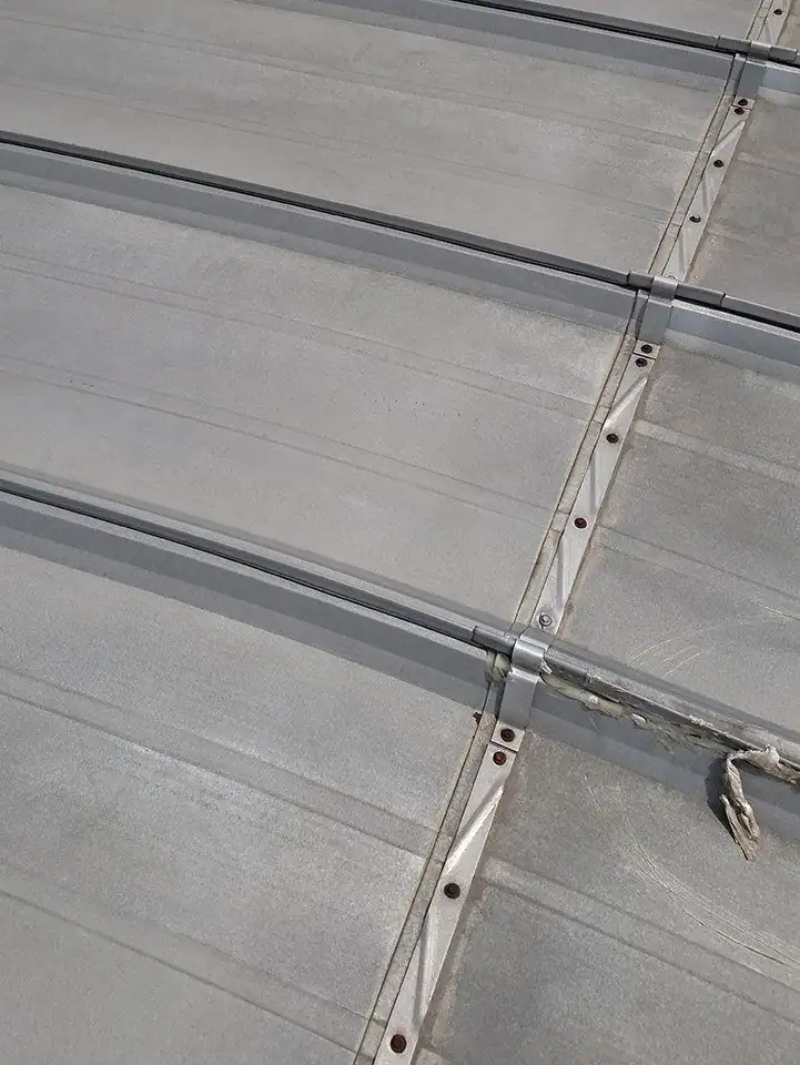 Close-up of a standing seam clip